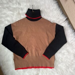 Women’s color block black and beige turtleneck sweater with accent
